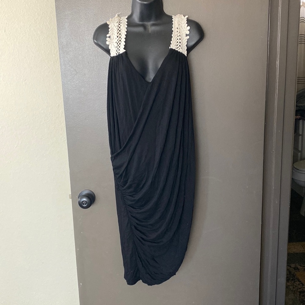 Black dress size 4 with cream colored crocheted shoulder straps